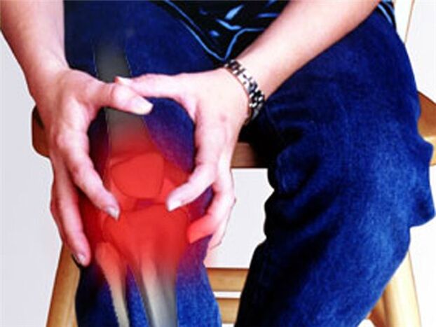 Dor na articulação do joelho causada por um processo patológico